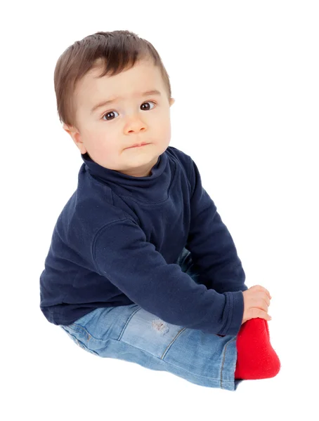 Adorable baby sitting on the floor isolated — Stock Photo, Image