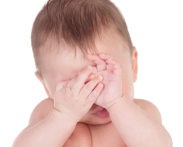 Bebé soñoliento cubriendo la cara con sus manos —  Fotos de Stock