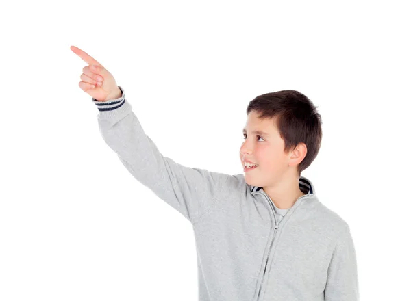 Smiling teenage boy of thirteen indicating something — Stock Photo, Image