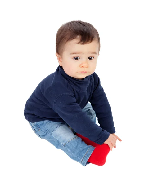 Adorable baby sitting on the floor isolated — Stock Photo, Image