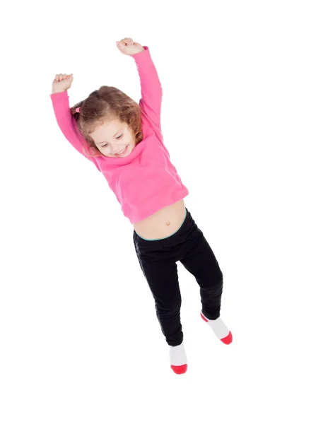 Menina feliz em rosa saltando — Fotografia de Stock