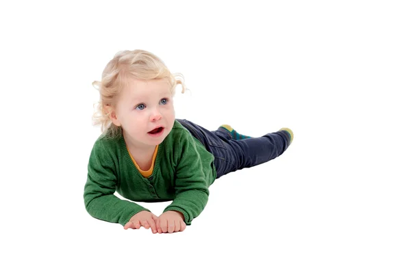 Adorable blond baby lying on the floor — Stock Photo, Image