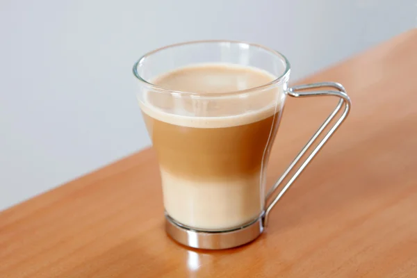 Tasty cup of coffee with milk — Stock Photo, Image