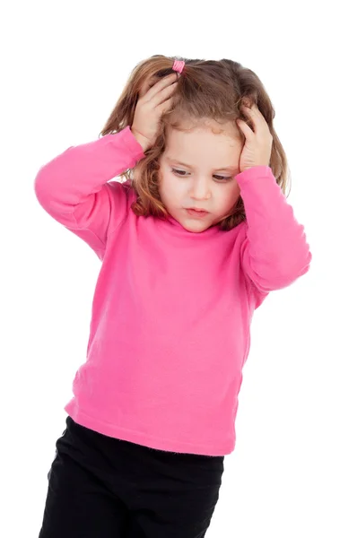 Worried little girl in pink — Stock Photo, Image