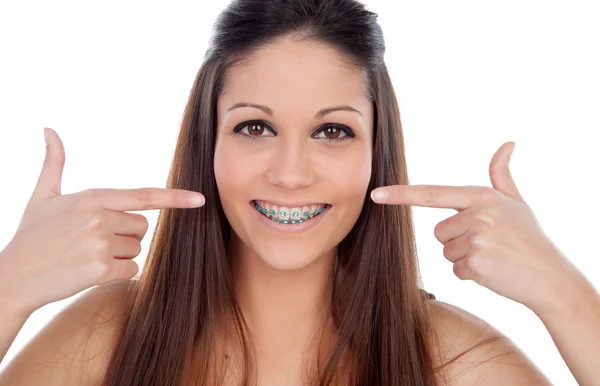 Aantrekkelijke jonge vrouw wijzend haar haken — Stockfoto