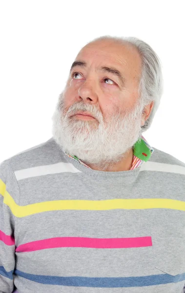 Старший чоловік з білою бородою дивиться вгору — стокове фото