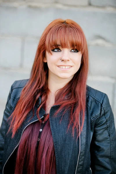 Rebellious teenager girl with red hair smiling — Stock Photo, Image