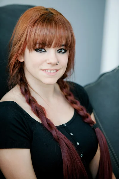 Rebellious teenager girl with red hair at home — Stock Photo, Image