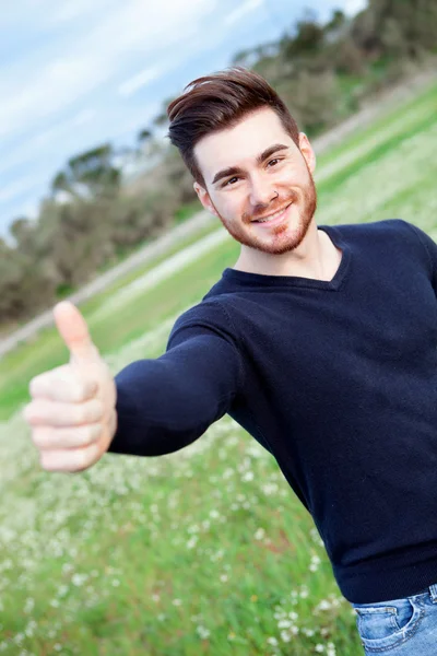 Cool handsome guy saying Ok at outside — Stock Photo, Image