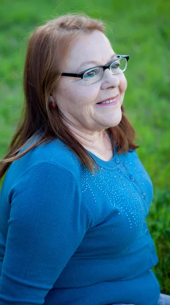 Senior woman smiling, outdoors — Stock Photo, Image