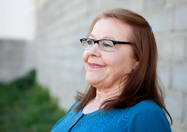 Senior woman smiling, outdoors — Stock Photo, Image