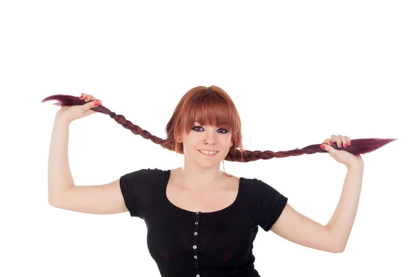 Teenage girl dressed  holding her braids — Stock Photo, Image