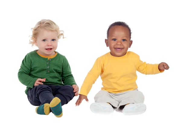 Couple of babies sitting on the floor — Stock Photo, Image