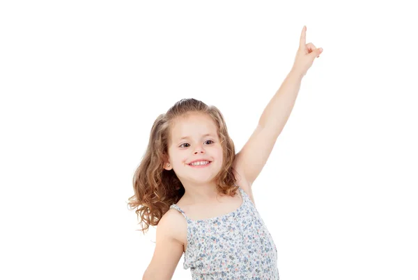 Happy little girl indicating something with the finger — Stok fotoğraf