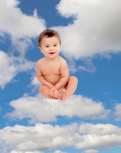 Little baby sitting on cloud in sky — Stock Photo, Image