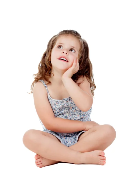 Pensive little girl with three year old sitting on the floor — Stok fotoğraf