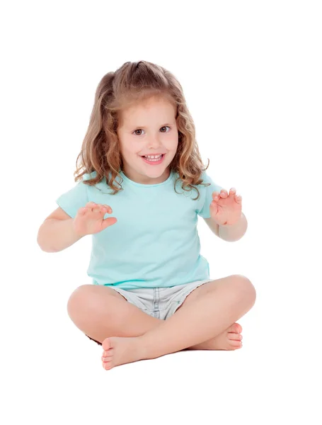 Cute little girl with three year old sitting on the floor Stock Picture