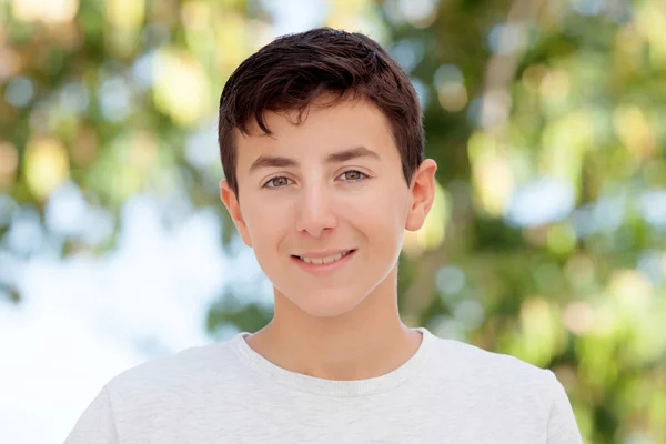 Teenage boy smiling outside — Stock Photo, Image