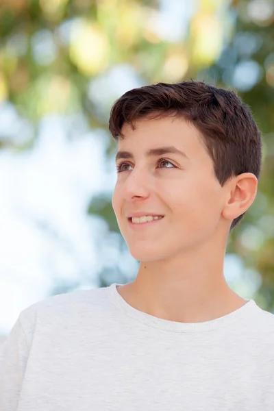 Teenage boy smiling outside — Stock Photo, Image