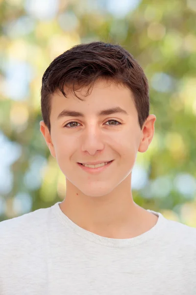 Teenage boy smiling outside — Stock Photo, Image