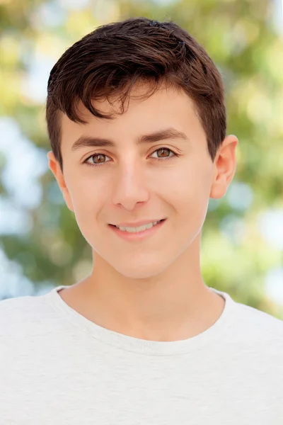 Teenage boy smiling outside — Stock Photo, Image