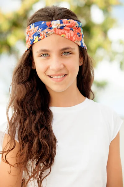 Teenager girl with a flowered headband — Stock Photo, Image