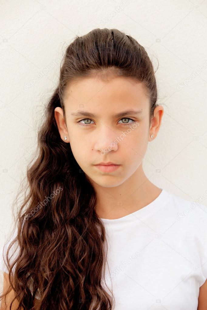Angry preteen girl with blue eyes