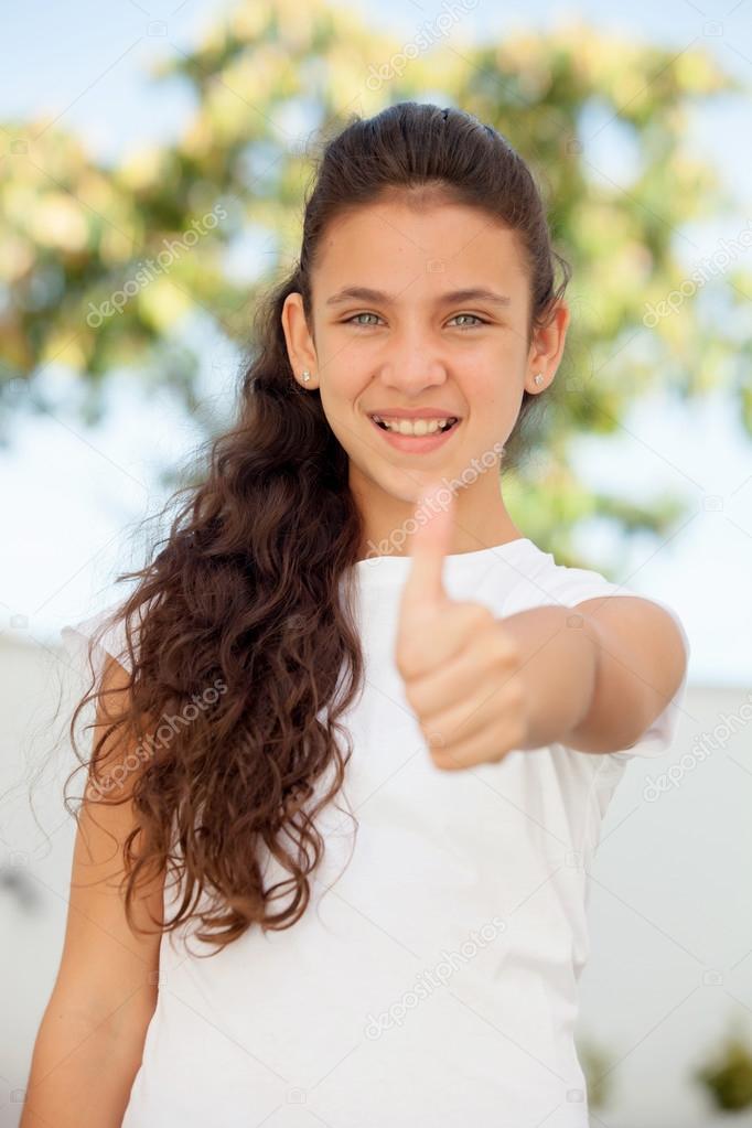 teenager girl showing thumb up