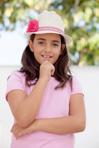 Pensive teenage girl in straw hat — Stock Photo, Image