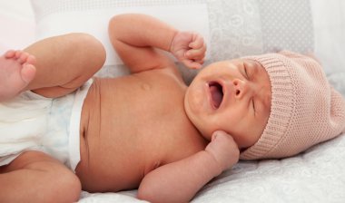 baby with wool cap crying clipart