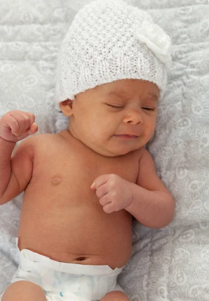 Baby with wool cap crying — Stock Photo, Image