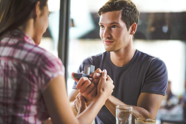 Engagement ring in cafe — Stock Photo, Image