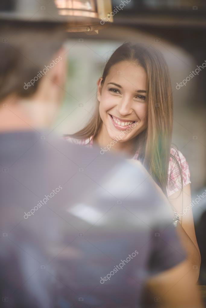 Young couple on first date drinking coffee — Stock Photo © ninann 54173865