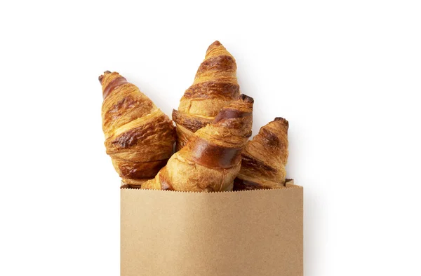 Croissant Saliente Saco Papel Colocado Sobre Fundo Branco Vista Cima — Fotografia de Stock