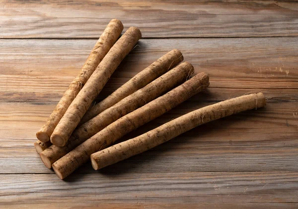 Una Bardana Colocada Sobre Fondo Tablas Madera Imagen Verduras —  Fotos de Stock