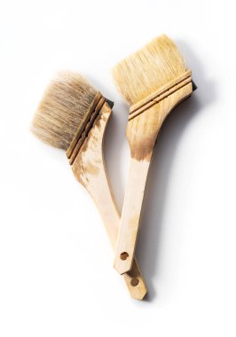 Brush used to apply oil stain to a white background clipart