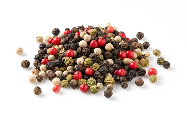 Pepper mix. Black, red, white, and green peppercorn on a white background. Depth-of-field composition.