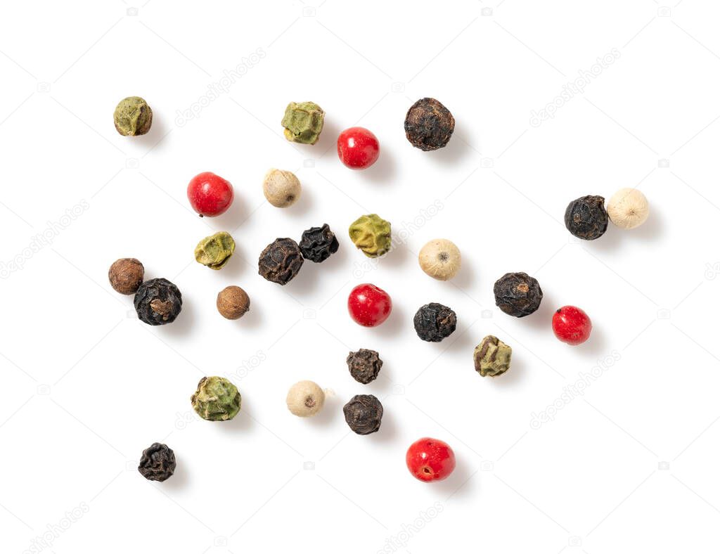 Pepper mix. Black, red, white, and green peppercorns on a white background. View from directly above.