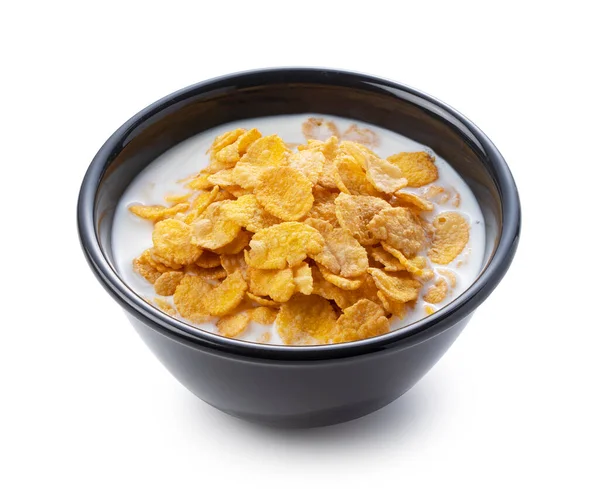 Milch Und Cornflakes Einer Schwarzen Schüssel Auf Weißem Hintergrund — Stockfoto