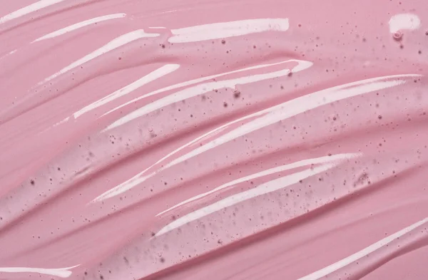 透明な液体ゲルの背景にピンクの背景に血清テクスチャ 透明美容スキンケア製品サンプル — ストック写真