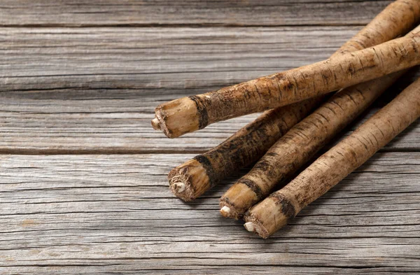 Una Bardana Colocada Sobre Fondo Tablas Madera Imagen Verduras —  Fotos de Stock