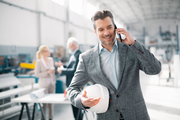 Businessman Using Phone Businessman Factory Stock Photo