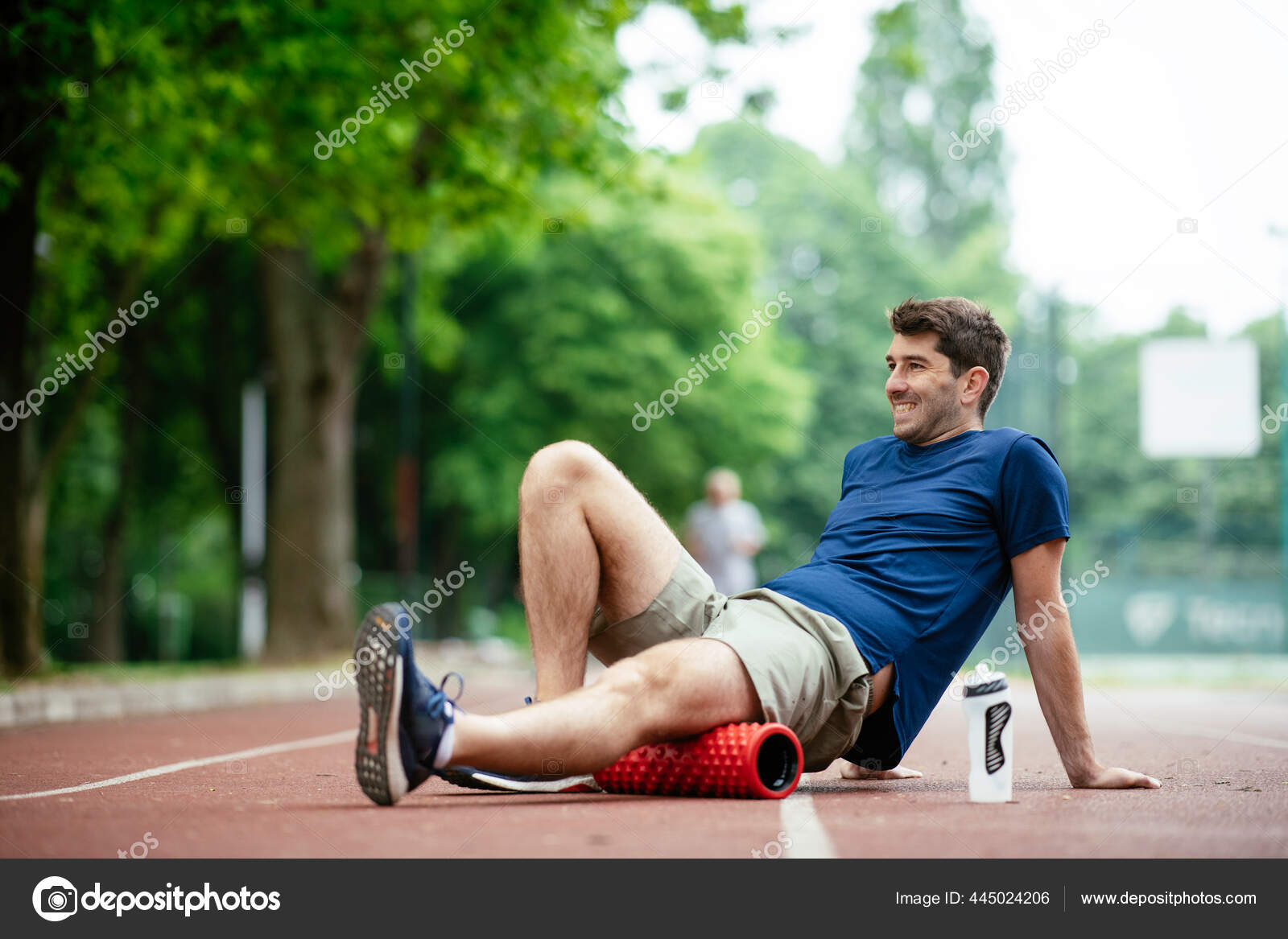 Man Foam Rolling Athlete Stretches Using Foam Roller Stock Photo by ©boriswebtise.rs 445024206