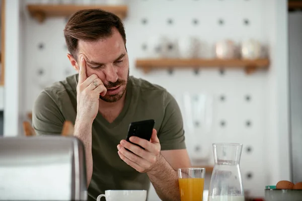 stock image man having breakfast on kitchen