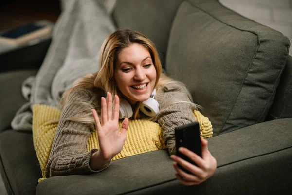 Happy Young Woman Lie Sofa Have Video Call Home Loft — Stock Photo, Image