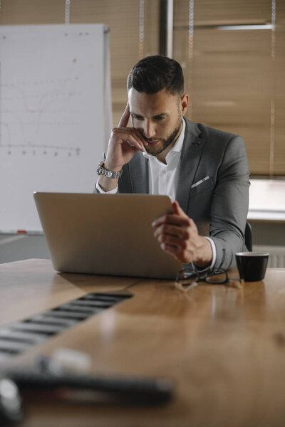 Businessman working in the office. Manager preparing for business presentation.