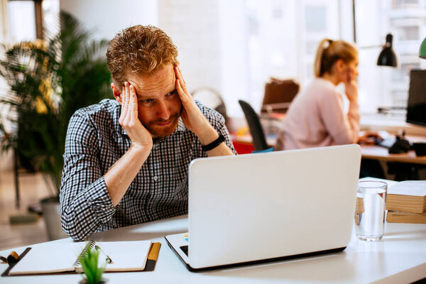 Tired Business Man Holding His Head Hand His Workplace Office Stock Photo