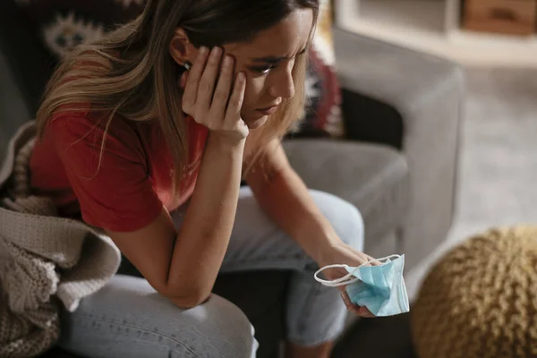 Young woman waiting results from the laboratory. Worried woman waiting Covid-19 test.