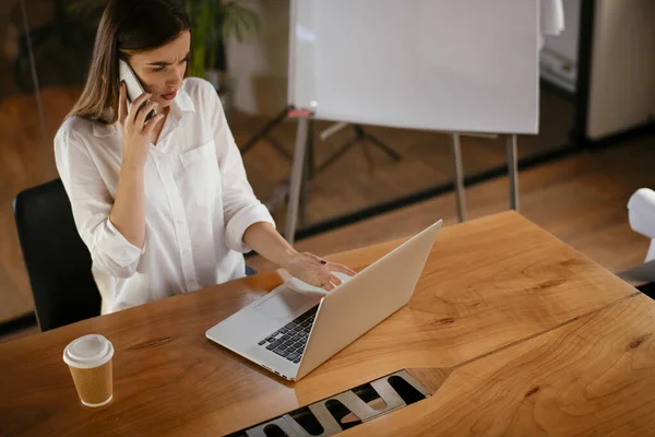 woman working in office at night