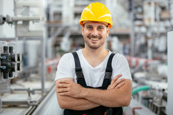 Factory worker. Young man working on the factory environment